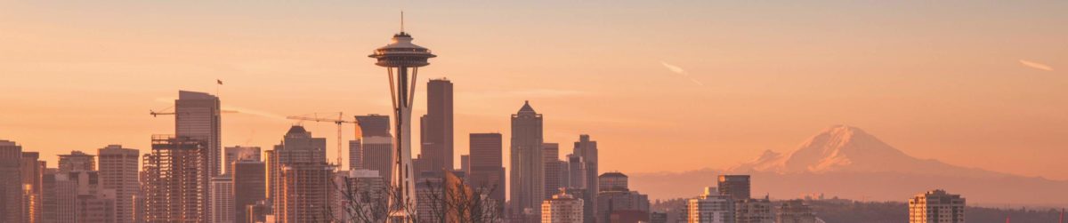 Sunset falls on downtown Seattle's panoramic skyline.